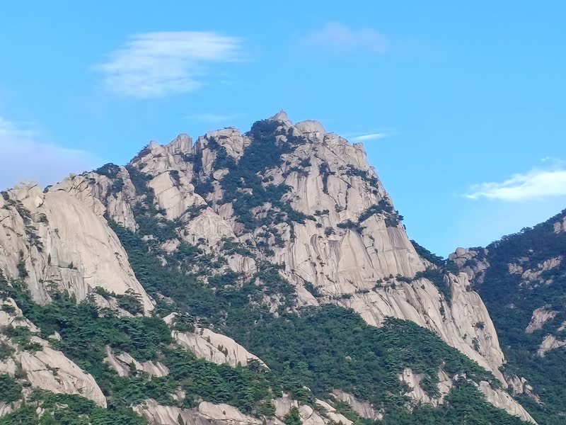 The bare granite dome of Baegundae, Bukhansan's highest peak, under a blue sky